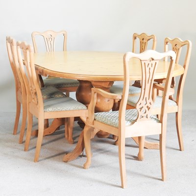 Lot 509 - A modern pine extending dining table, with an...