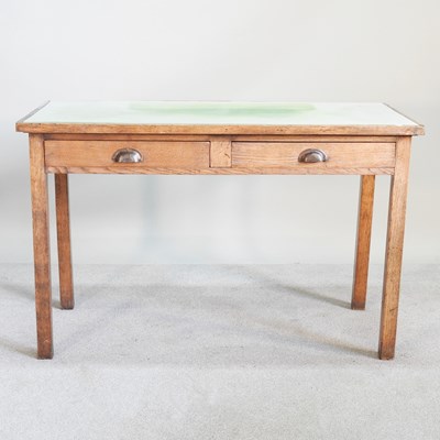 Lot 463 - A mid 20th century light oak writing table,...