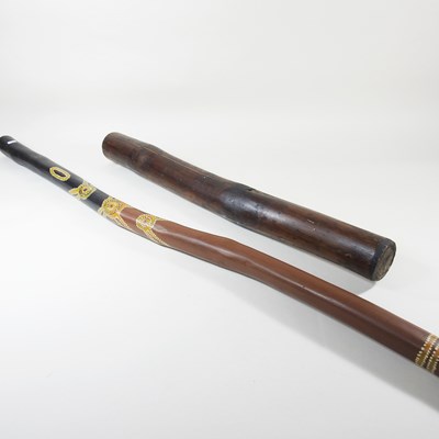 Lot 165 - A rainmaker, together with a didjeridoo, 145cm...