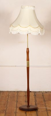 Lot 622 - A mid century teak standard lamp
