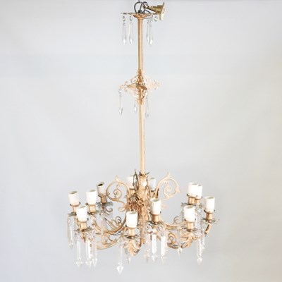 Lot 132 - A brass twelve branch chandelier, with cut...
