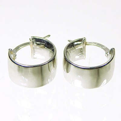 Lot 82 - A pair of 14 carat white gold cuff earrings,...