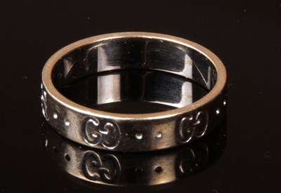 Lot 117 - An 18 carat white gold Gucci ring, decorated...