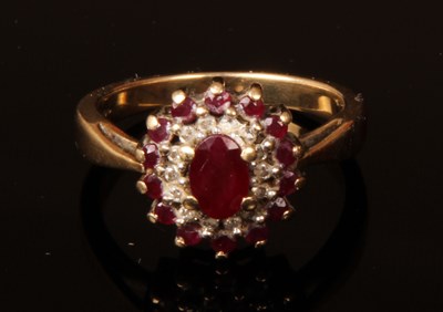 Lot 17 - A 9 carat white gold ruby and diamond cluster...
