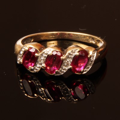 Lot 35 - A 9 carat ruby and diamond dress ring, size M,...