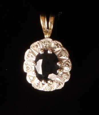 Lot 33 - A 9 carat yellow gold sapphire and diamond...