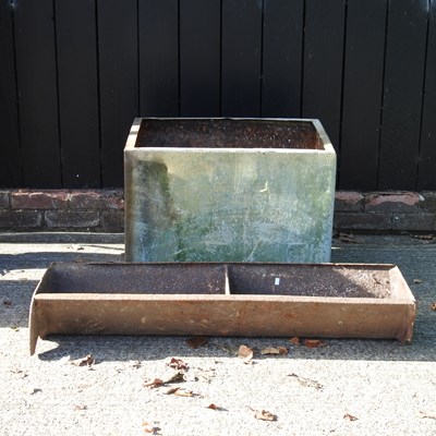 Lot 238 - A cast metal water tank, 66cm wide, together...