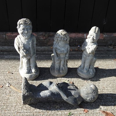 Lot 598 - A collection of cast stone garden ornaments,...