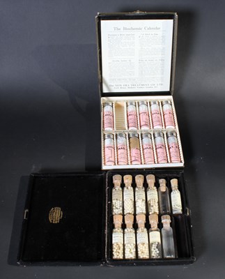 Lot 656 - Two sets of homeopathic medicine bottles, one...