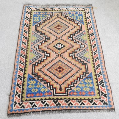 Lot 306 - A Persian rug, with three central medallions,...
