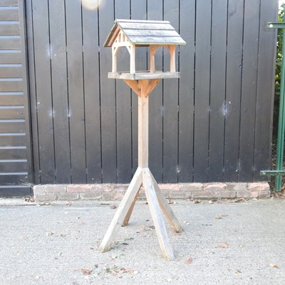 Lot 411 - A wooden bird table, 170cm high