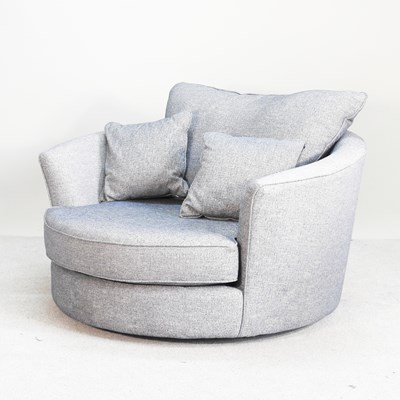 Lot 127 - A modern blue upholstered swivel snuggler...