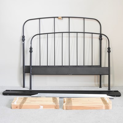 Lot 321 - A modern black metal double bedstead, with a...