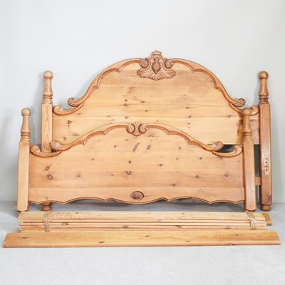 Lot 631 - A modern pine double bedstead, with scrolled...