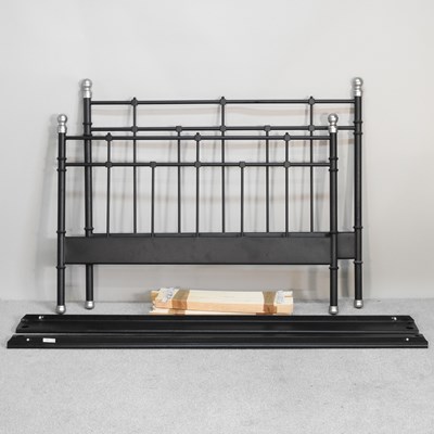 Lot 474 - A modern metal double bedstead, with a slatted...