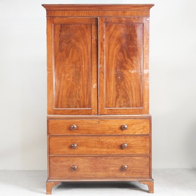 Lot 633 - A 19th century mahogany linen press, on...