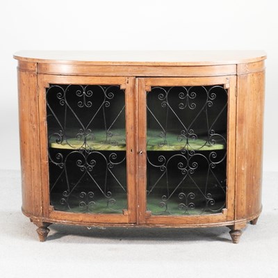 Lot 563 - A 19th century continental bow front sideboard,...