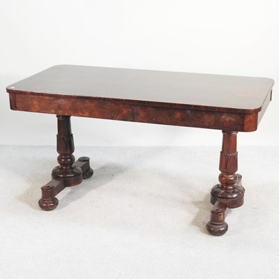 Lot 302 - A late Regency rosewood sofa table, on carved...