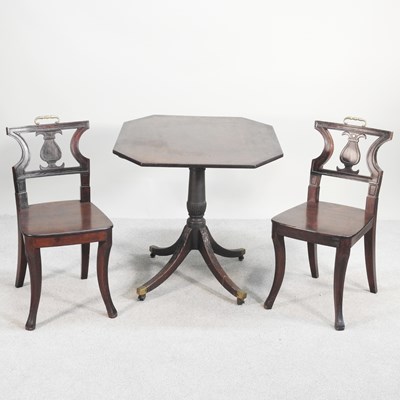 Lot 262 - A pair of Regency carved mahogany hall chairs,...