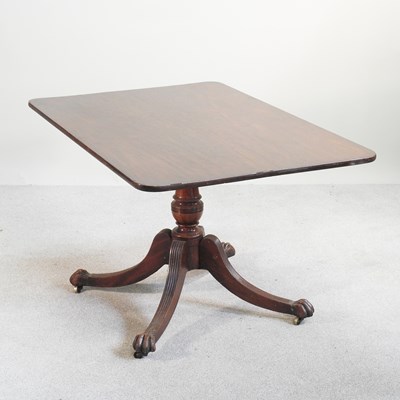 Lot 366 - A Regency mahogany dining table, with a hinged...