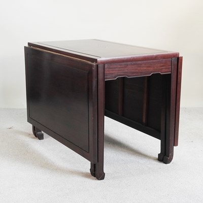 Lot 287 - A Chinese rosewood drop leaf dining table,...