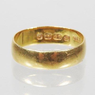Lot 1 - A 22 carat gold wedding band, of plain design,...