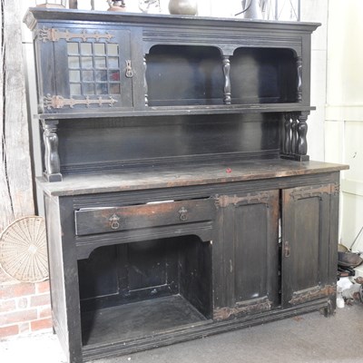 Lot 12 - An early 20th century dark oak dresser
