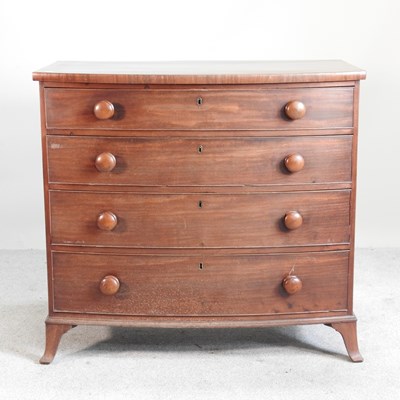 Lot 406 - A 19th century mahogany bow front chest, on...