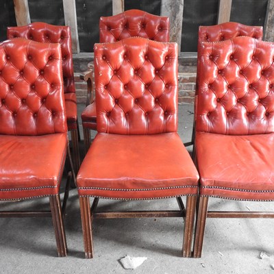 Lot 13 - A set of ten red upholstered dining chairs