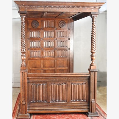 Lot 46 - A carved oak four poster bed, late 20th...