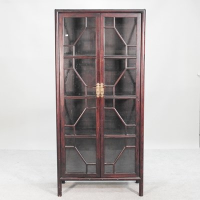 Lot 683 - A Chinese astragal glazed display cabinet,...