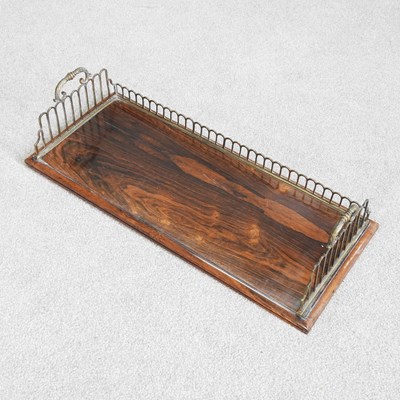 Lot 607 - A 19th century rosewood book trough, with a...