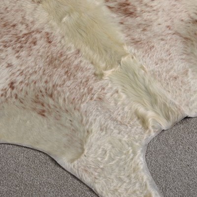 Lot 20 - A cow hide rug, 244 x 186cm