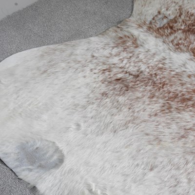 Lot 20 - A cow hide rug, 244 x 186cm