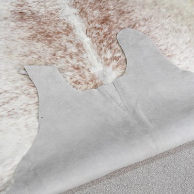 Lot 20 - A cow hide rug, 244 x 186cm