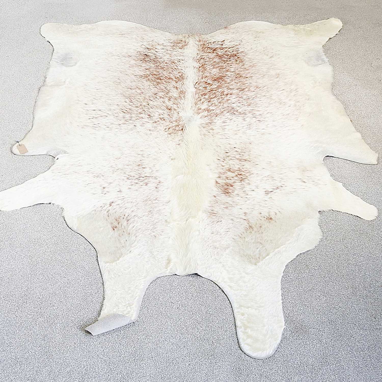 Lot 20 - A cow hide rug, 244 x 186cm