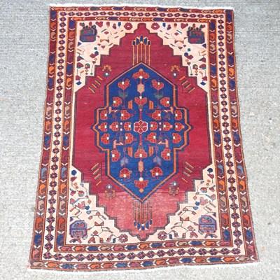 Lot 168 - A woollen prayer rug, with geometric designs,...