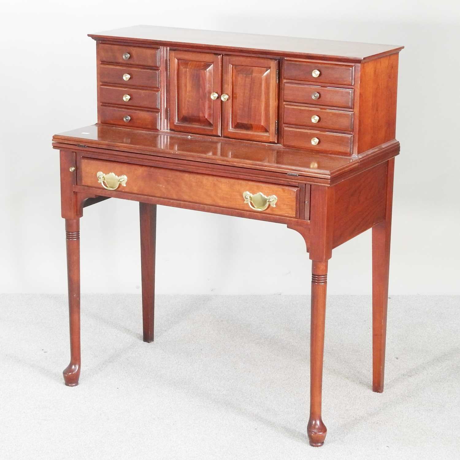 Lot 186 - A reproduction cherrywood writing desk, with