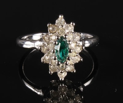 Lot 161 - An 18 carat white gold emerald and diamond...