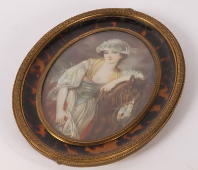 Lot 614 - A portrait miniature of a lady with a horse,...