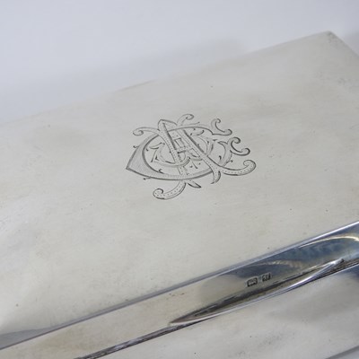 Lot 11 - An early 20th century silver table cigarette...