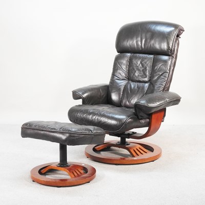 Lot 420 - A modern Ekornes style reclining swivel...