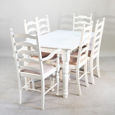 Lot 449 - A modern white painted dining table, with a...