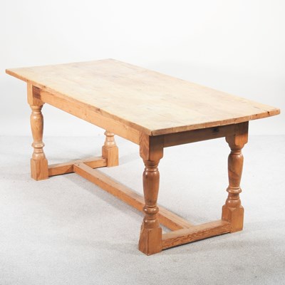 Lot 255 - A modern pine refectory table, on turned supports