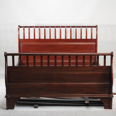 Lot 471 - A modern hardwood double bedstead, with a...