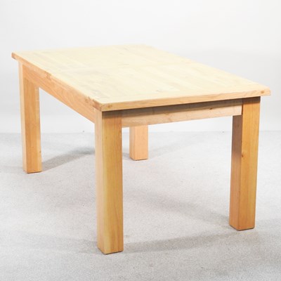 Lot 281 - A modern light oak dining table, of...