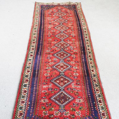 Lot 158 - A Persian runner, with a row of central...
