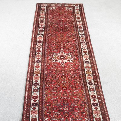 Lot 180 - A Persian malayer runner, with floral designs...