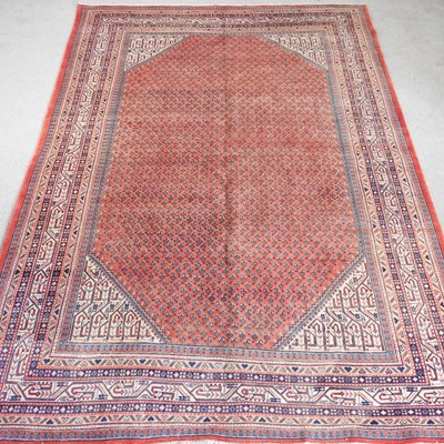 Lot 560 - A Persian arak carpet, with all over designs...