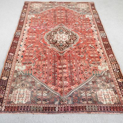 Lot 554 - A Persian qashgai carpet, with a central...